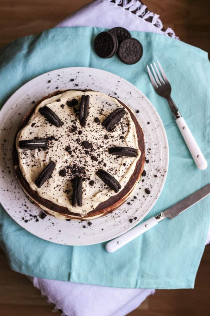 Oreo crepe cake with visible layers of crepes, whipped cream, and crushed Oreos.