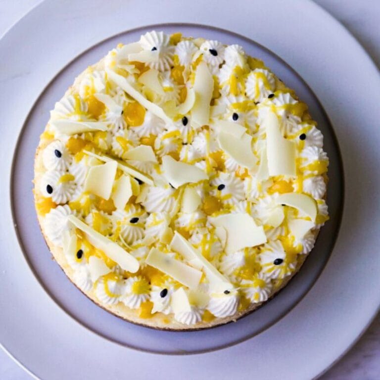 White Chocolate cheesecake with passion fruit curd in a white plate