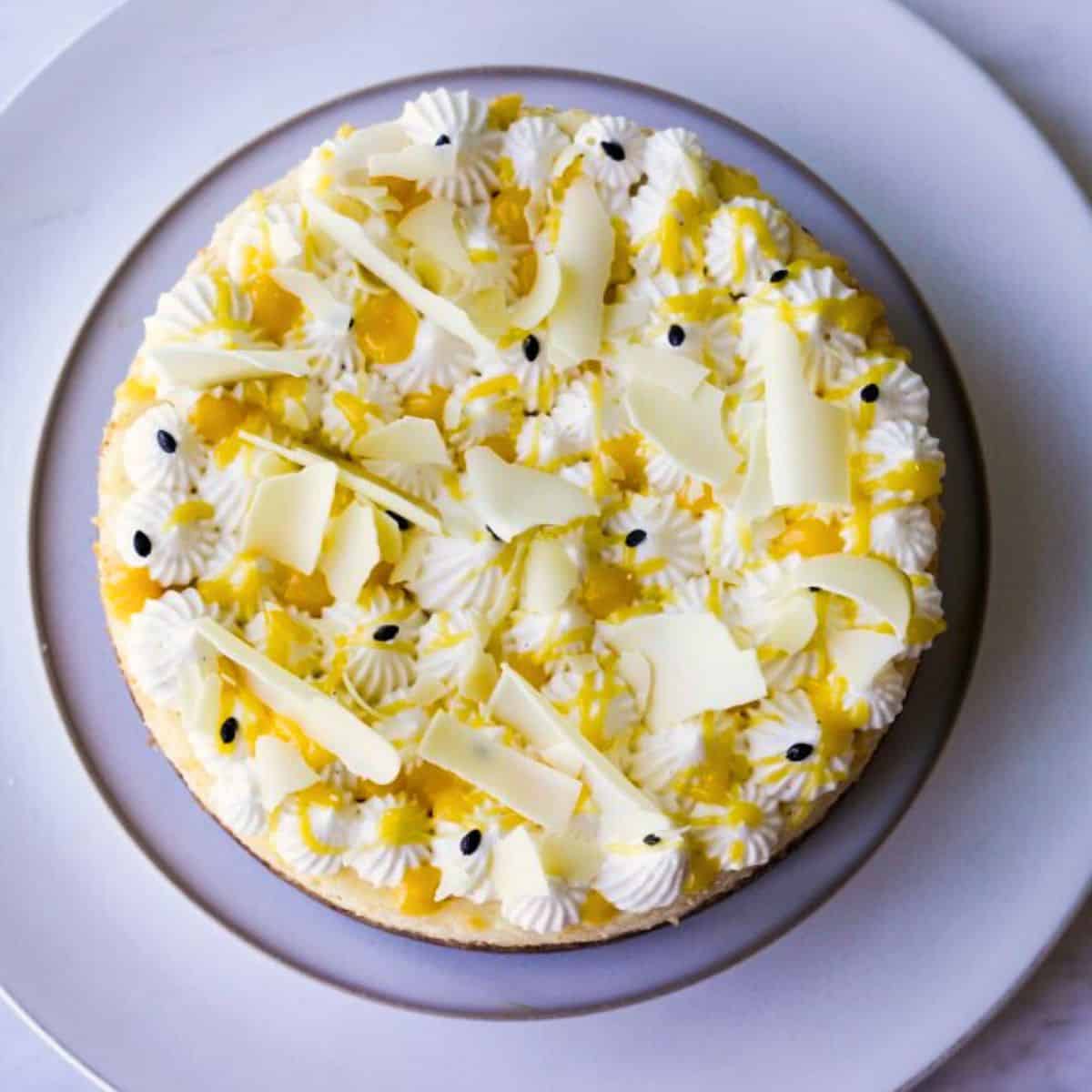 White Chocolate cheesecake with passion fruit curd in a white plate