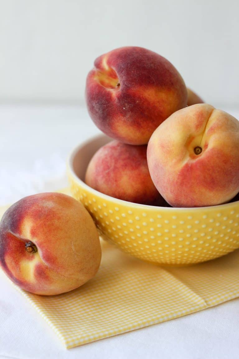A bowl of fresh summer peaches