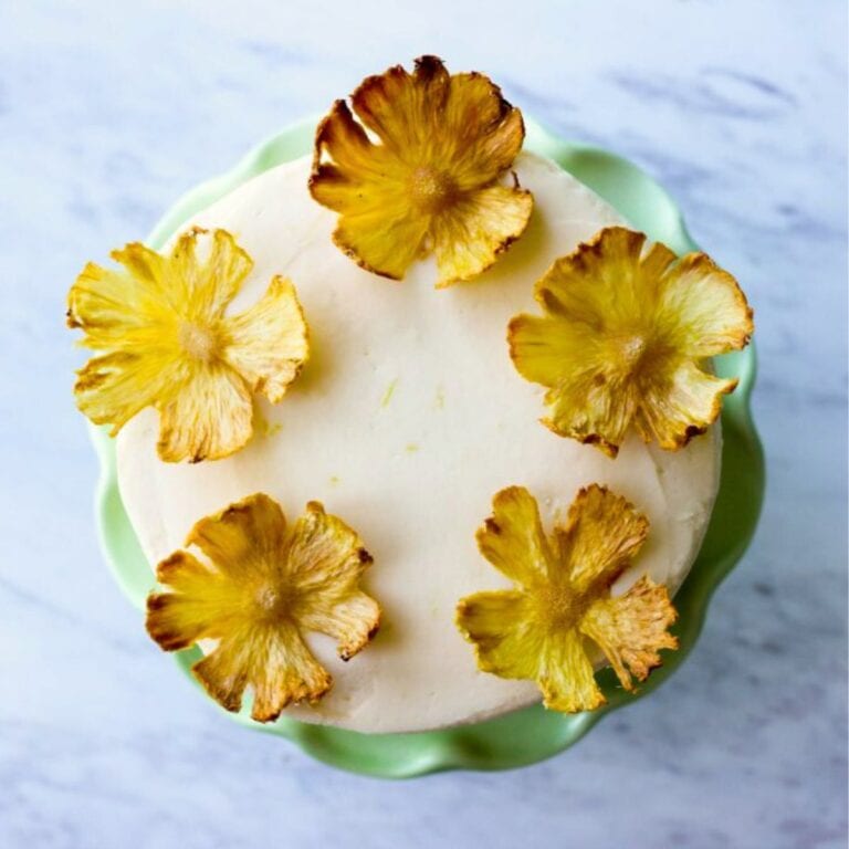 Pina colada cake on a green cake stand