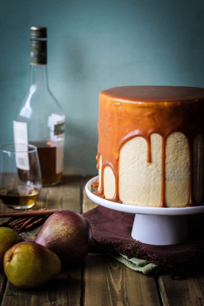 Finished pear cake with salted caramel drip and silky buttercream
