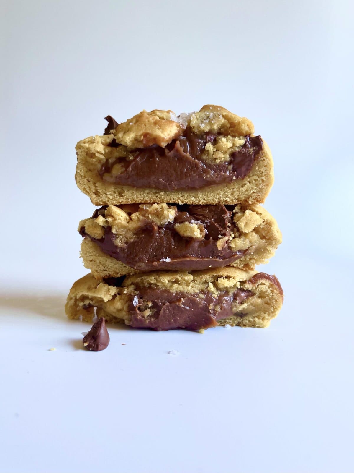 Stack of brown butter chocolate chip cookies with fudgy filling.