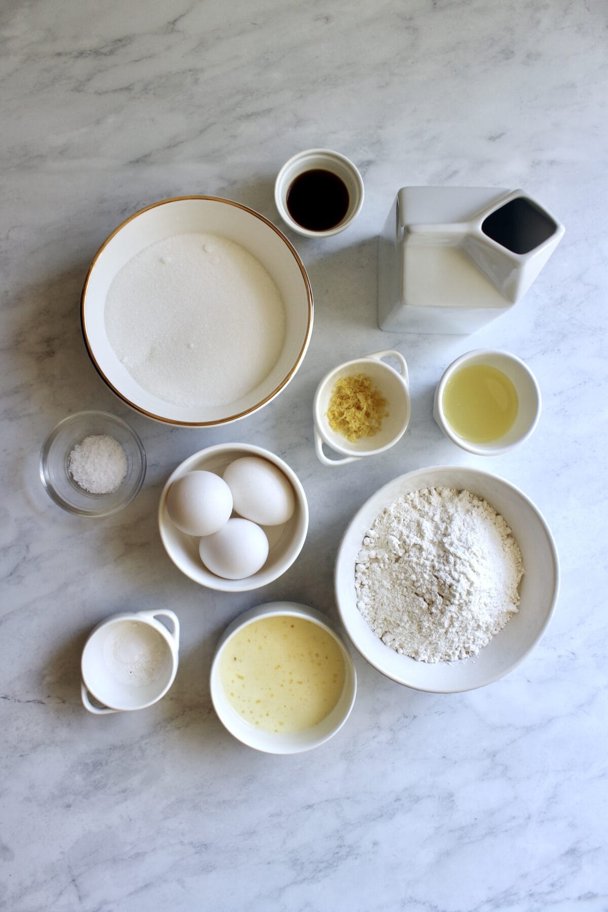 Prepped ingredients for lemon blackberry cupcakes on a countertop