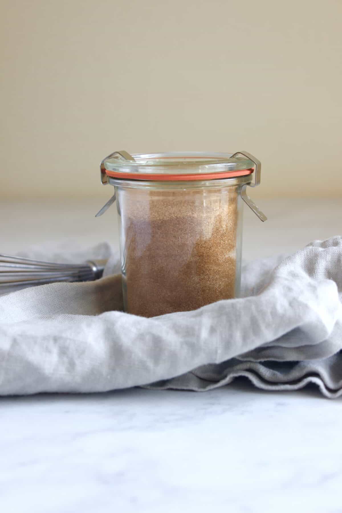 Storing homemade cinnamon sugar blend in airtight container.