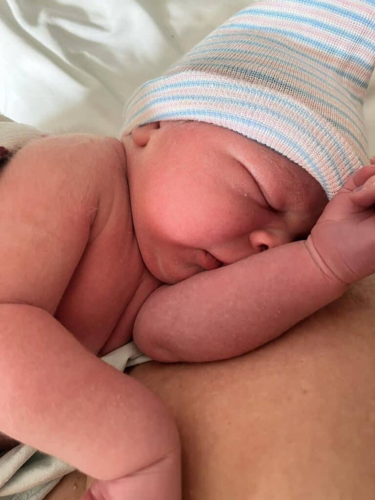 Newborn baby on mom's arms