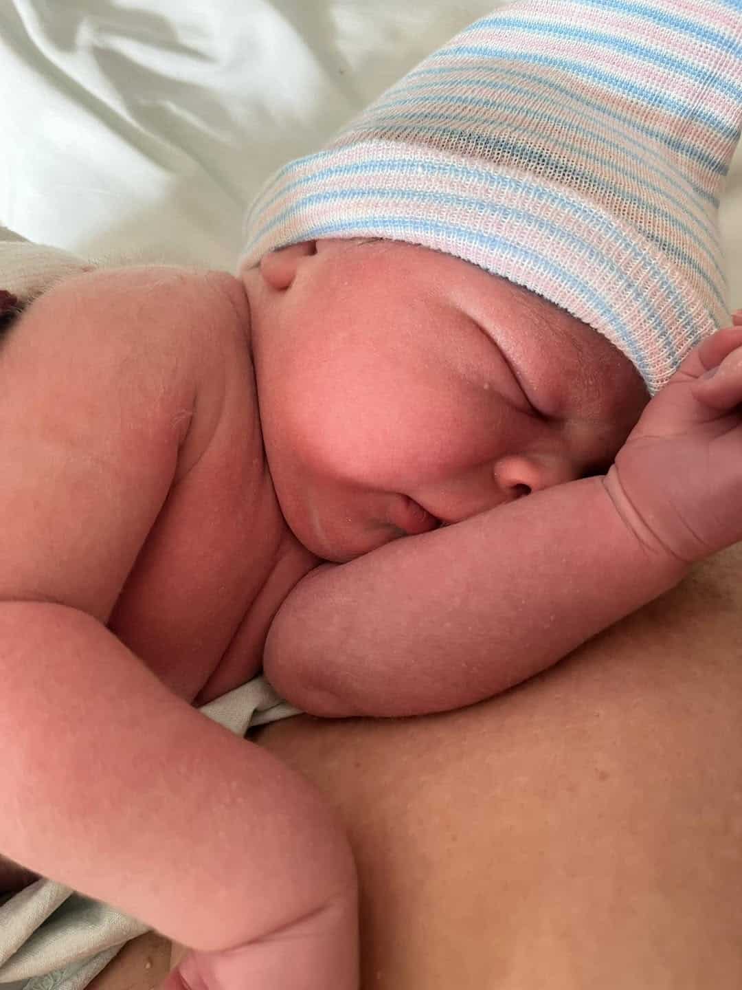 Newborn baby on mom's arms